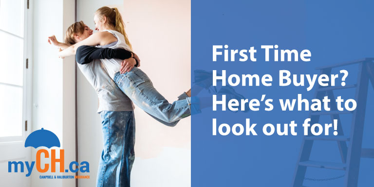 man picking up woman in their new home as first time home buyers